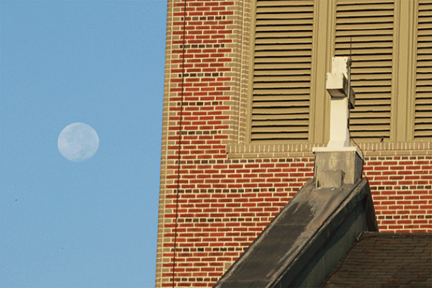 August’s Supermoon Blue Moon was on display Wednesday morning in this photo taken showing St. Anthony of Padua Catholic Church in the foreground. (Photo by Harlan Kirgan)