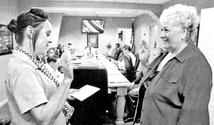 Lynn LeJeune, right, takes an oath as board member of the St. Landry Parish Economic Industrial Development District on Tuesday administered by Lisa Doyle of the St. Landry Parish Clerk of Court Office. LeJeune is president of the St. Landry Parish Chamber of Commerce and former mayor of Eunice.