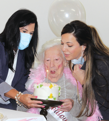 Mary Tate Collier, a resident at Eunice Manor, celebrated her 100th birthday with a party Friday. Collier and her late sister, Ethel Tate, owned and managed Mary Collier Fashions from 1966 until 1984. Blowing out her candle on her birthday cake with her are Nickie Toups, administrator, left, and Lauren Lirette, minimum data set nurse at Eunice Manor. 