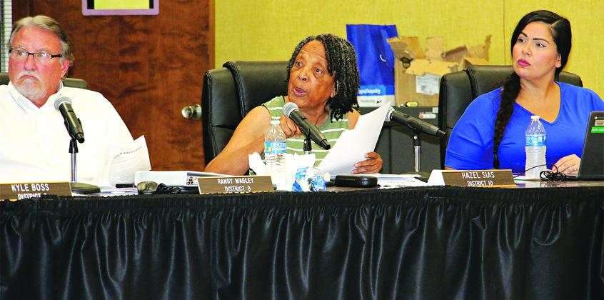 St. Landry Parish School Board members, from left, Randy Wagley, Hazel Sias and Tiffany Nolan at Monday’s committee of the whote meeting. (Photo by Harlan Kirgan)