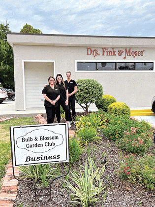 The Bulb &amp; Blossom Club of Eunice awarded the August Business Yard of the Month to Drs. Fink &amp; Moser located at 301 South 2nd. The landscaping features vinca, coleus, day lilies, foxtail ferns and a variety of shrubbery.  From left are Kylie Doucet, Katelyn Smith and Sadie Carrier. (Submitted photos)