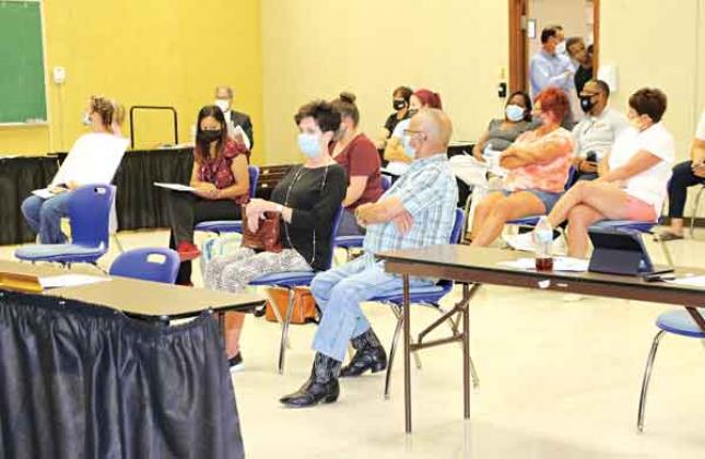 Several people were in the audience at Thursday’s St. Landry Parish School Board meeting and many voiced their approval and disapproval of the School Board’s action on employee vaccination. School employees will be required to be vaccinated or submit to weekly COVID-19 testing. (Photo By Harlan Kirgan)