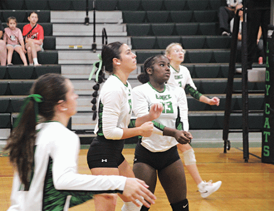 Sophomore setter Cayli Lemelle, in the photo at left, during the Eunice High tournament against Lafayette Renaissance Charter Academy on Sept. 7. Photo at right shows, from left Brooklyn Darbonne, Cayli Lemelle and Ava Grace Brown. The player at left is not identified.. (Photo by Rhett Manuel)
