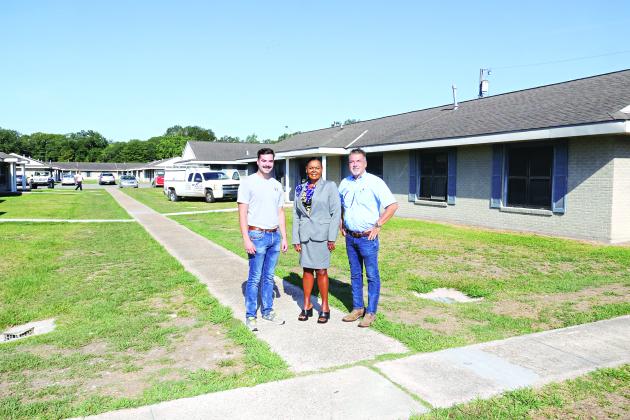 Thirty apartments have been renovated following flooding in 2016 at Acadian Village in Eunice. From left, are Noah Clause, Angelia Guillory and David Clause. Guillory is the Housing Authority director. The Clauses are with Clause and Sons Construction, of Eunice. (Photo by Harlan Kirgan)