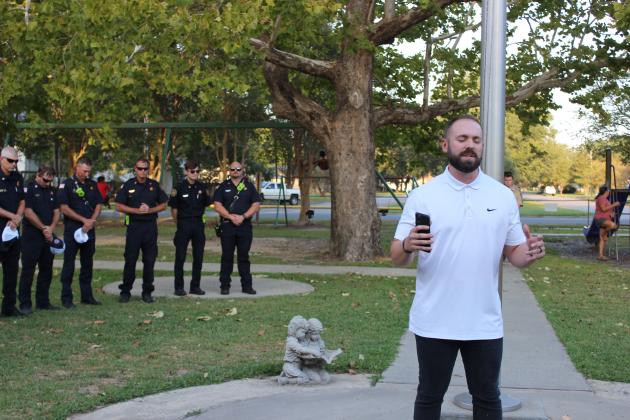The Rev. Weston Weaver, executive pastor at New Hope Fellowship, performs the invocation at the 911 ceremony held at Circle Park Monday.