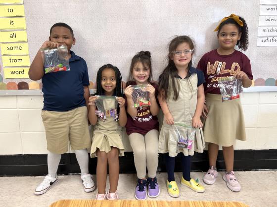 First grade students in Caitlyn Estes class at East Elementary were honored as acheiving the most Dojo points as towards Best Behavior for the month of August. They are Jakhi Edwards, left, Olivia Leger, Madison Brown, Felicity Brown and Zillah Meyers.