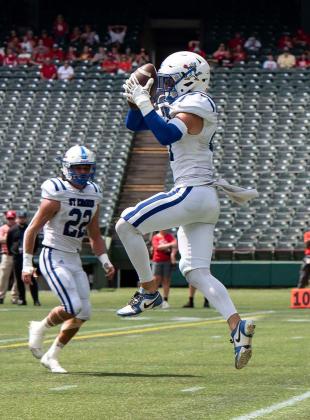 Blue Jay’s safety/kicker Lannie Reed intercepts the ball at the Catholic Bowl in Muenster, Texas. The St. Edmund Blue Jays won 55-6 against Sacred Heart. (Photo by Dwight Jodon)