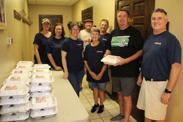 Ardoin’s employees involved included, back, from left, Steven Richard and Junior Fontenot; front, from left, Rachel Israel, Alexis Miller, Gabrielle Coussan, Carolyn Aucoin, Elaine Deville, Mayor Scott Fontenot and Bill Wimberly. Not pictured are Kim Fontenot and Chrissie Menard. The ceremony included a blessing of vehicles and first-responders.