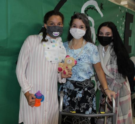 On Tuesday there were many “Babies and Boomers” seen on campus at Eunice High. From left, are Bailey Turner, Chloe Bollich and Brianna Cormier.