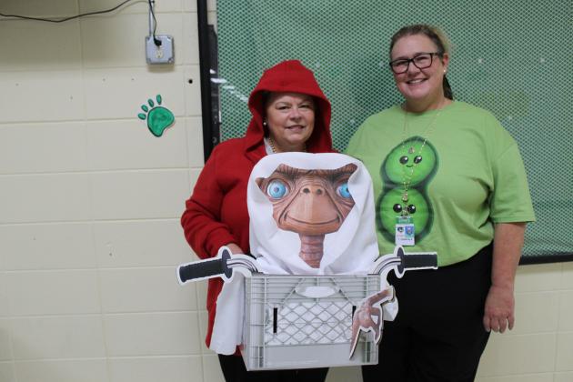 ET and Sweet Pea, Alicia Guillory Bielstein and Theresa Gainfala dressed Tuesday as “Rhyme without a Reason.”