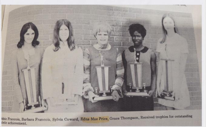 A clipping from The Eunice News. Edna Price is pictured fourth from left. The group of Eunice High students received trophies of outstanding athletic achievements.