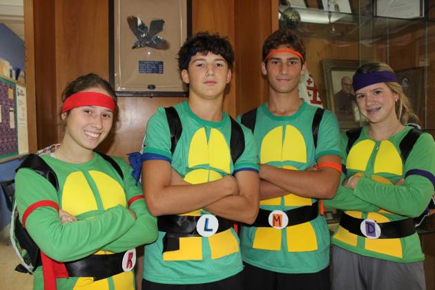 Some Teenage Mutant Ninja Turtles were seen Monday on campus at St. Edmund HIgh School as students celebrate homecoming week festivities. From left, are Caroline Trahan, a senior; Owen Cart, a sophomore; Ethan Trahan, a junior; and Sloane Cart, a freshman.