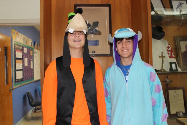 Ross Bertrand, left, and Daniel Seth Brown, both juniors, are dressed Monday as Movie Characters. St. Edmund High students are celebrating homecoming week with different designated dress up days.