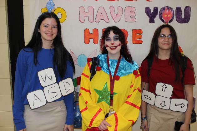 Makayla Guillory, left, Mckinlee Duplichan and Myka Fontenot dressed Wednesday for homecoming festivities.