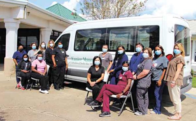 Eunice Manor is ranked among the top five nursing homes in the state in Newsweek’s America’s Best Nursing Home ranking. Nickie Toups, administrator, is with her nursing home staff. Seated, from left, are Lasetta Mayo, therapy tech and CNA; Sonsherryler Thomas, CNA; Toups; and April Williams, housekeeping supervisor.  In back, from left, are Betty Rosette, laundry; Saundra Frey, director of nursing; Lauren Lirette, MDS coordinator, LPN; Lindsay Doucet, transportation driver; Danielle Lonnett, housekeeping; T