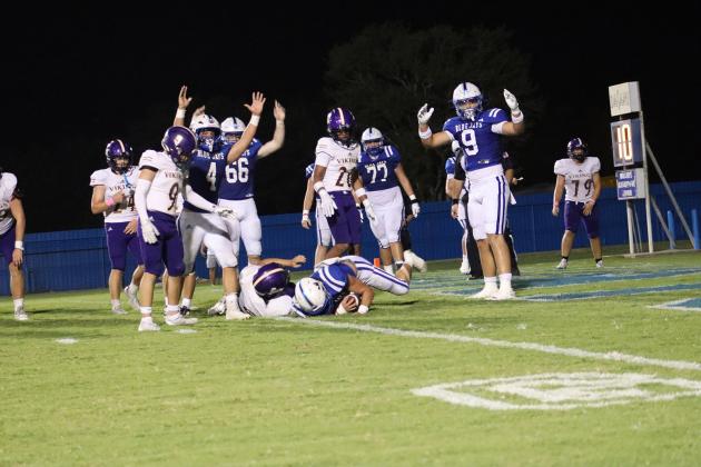 St. Edmund’s Wyatt Dubois, No. 22, wide receiver and safety, scores a touchdown during last Friday’s evening match up against Opelousas Catholic Vikings. (Photo by Amy Myers)