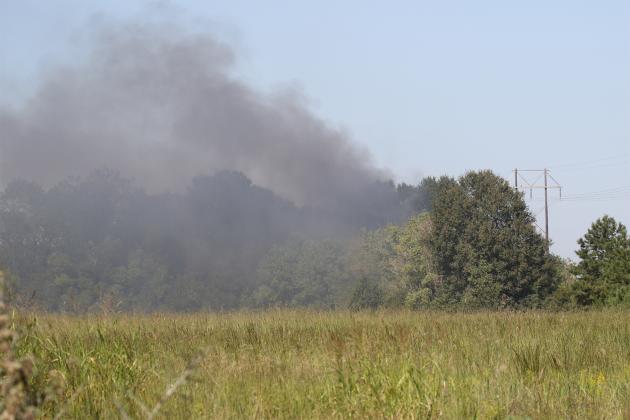 Smoke billows from the site of the fire. The photo is from the Acadian Medical Center ground looking north.