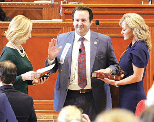 State Rep. Phillip DeVillier receives his oath of office as Louisiana Speaker of the House on Jan. 8 from House Clerk Michelle Fontenot, left, At right is DeVillier’s wife, Lisa. The DeVilliers are from Eunice and Fontenot is a native of Eunice. (Photo by Harlan Kirgan)