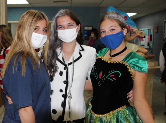 St. Edmund High students dressed as their favorite ‘Movie’ or ‘Movie’ character Monday. From left, are Isabella Heinen, Laura Beth Zaunbrecher and Ava Guillory, all sophomore students.
