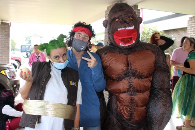 Some movie characters were seen on campus at St. Edmund High Monday. From left, are Elizabeth McGee, Cain Miller and Williams Driggs, all seniors.