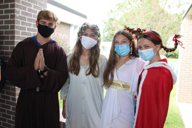 Tuesday was declared “Letter Day” at St. Edmund High. Students dressed as the first letter of their first name. From left, are Jacob Bearb, a junior, Gracie Cormier, Ava Guillory and Claire Beth Prudhomme, all sophomores.