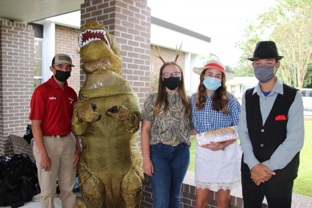 St. Edmund students dressed as a ‘First Initial Letter’ of their first name. From left, are John Logan Floyd, freshman, Trent Thibodeaux, sophomore, Bailey Conde, freshman,  Lauren McGee, freshman, John Landry, freshman.