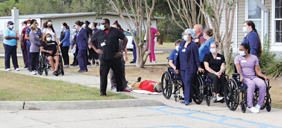 Eunice Manor employees played their part as patients and employees at a drill on  Wednssday. The drill was conducted around a kitchen fire. (Photo by Harlan Kirgan)