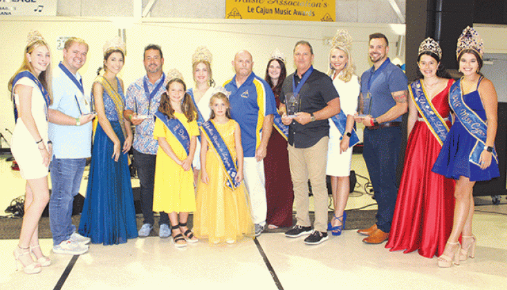 Kevin Naquin &amp; Cajun Preservation Band was presented the CFMA Band of the Year Award during the 2023 CFMA Music Festival held at the Rayne Civic Center. Band members are joined by a number of queens/royalty and Taking part in the presentation were a number of queens/Cajun music royalty and CFMA National Board President Troy Fontenot. (Acadian-Tribune photos by Josie Henry)