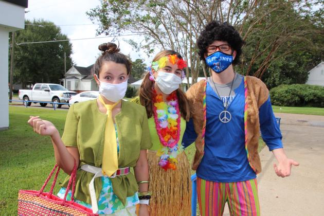 Kailey Miller, a senior, Lauren McGee, freshman, and Alex Ortego, a freshman dress for “Tacky Day” during homecoming week festivities at St. Edmund. (Photos by Myra Miller)