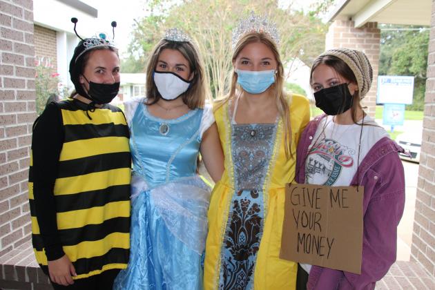 St. Edmund High students celebrate homecoming week. Students dressed as “Merchants” and “Kings and Queens” Thursday.  From left, are Elizabeth McGee, Kennedy Ardoin, Audrey Chaumont, all seniors, and Claire Beth Prudhomme, a sophomore.