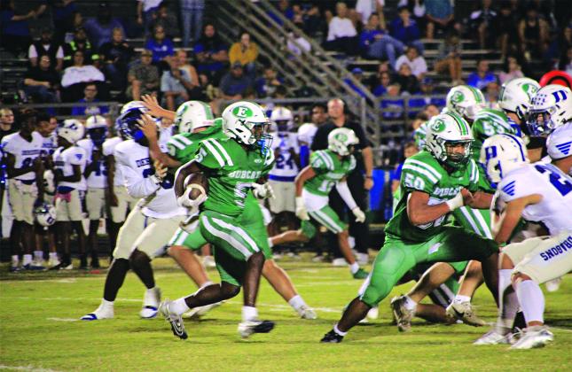 Bobcat running back Thaddeus Godfrey is on the move against Deridder. (Photos by Rhett Manuel)