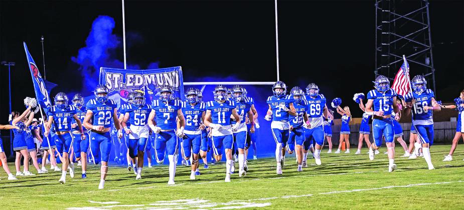 The St. Edmund High School football team takes the field for their homecoming game with Berchmans Academy on Oct. 11. (Photo by Dwight Jodon)