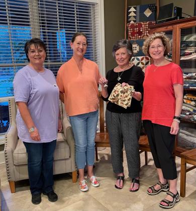 Louisiana Garden Club Federation District VII Director Ammy Taylor attended the Bulb &amp; Blossom Garden Club’s October meeting. From left, are Mona Redlich, member and host; Taylor; Lynn Pavich, member and winner of a door prize; and Celeste Gomez, Bulb president. (Submitted photos)