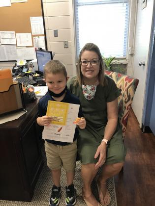 East Elementary recognized its “Positive Office Referral” students. From left, are Henry Boquet, a kindergartener, and Principal Gina LaGrange.