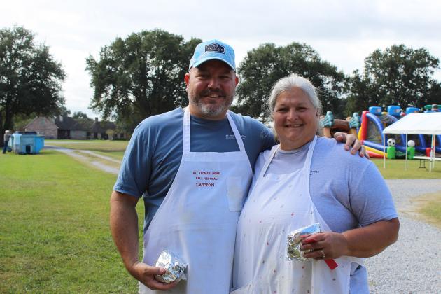 Layton and Angie Thibodeaux chose BBQ hamburgers for their lunch Saturday at the St. Thomas More Church annual Bazaar.