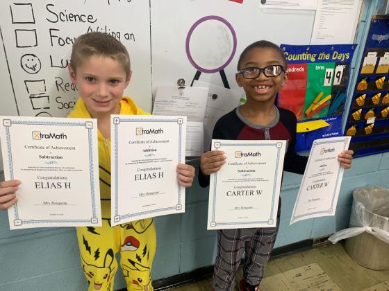 Elias Huval, left, and Carter Williams, first graders at Glendale Elementary have achieved Xtra Math certificates in addition and subtraction fact fluency. Wendy Rougeau is their math teacher. (Submitted photo)