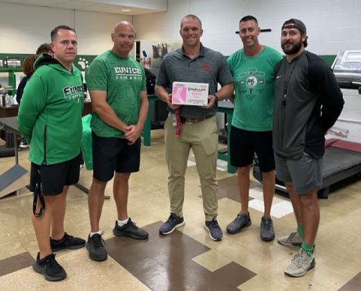 Donation of pink tape from AMC for EHS football players to wear in honor of Breast Cancer Awareness Month.