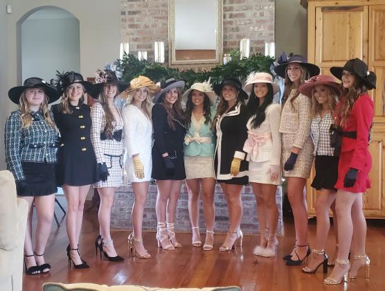 St. Edmund maids enjoy a traditional homecoming tea.