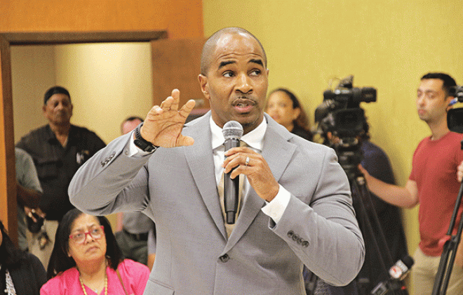 Milton Batiste makes his presentation before being selected as St. Landry Parish superintendent. (Photo by Harlan Kirgan)