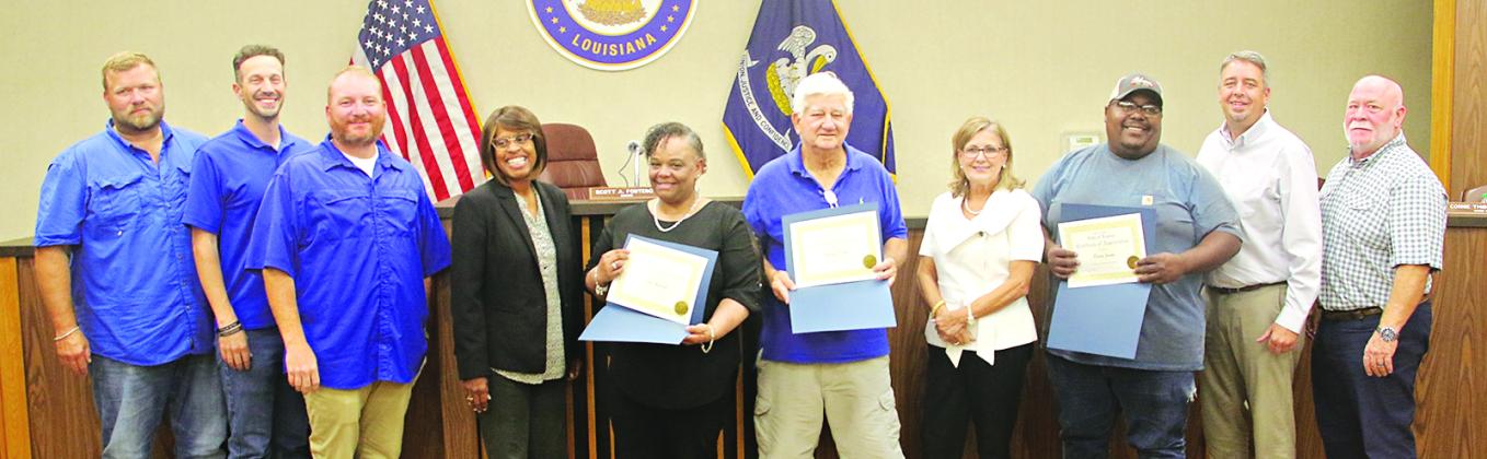 Three volunteers in Eunice were honored during Tuesday’s Mayor and Board of Aldermen meeting. The volunteers are Dorsey Jacobs, Randy Cooper and Debra Guillory. From left, are Stan Feucht, city attorney; Chad Andrepont, alderman; Randall Reed, alderman; Germaine Simpson, alderwoman; Guillory; Cooper; Connie Thibodeaux, alderwoman; Jacobs; Scott Fontenot, mayor; and Marion “Nootsie” Sattler, alderman at-large.