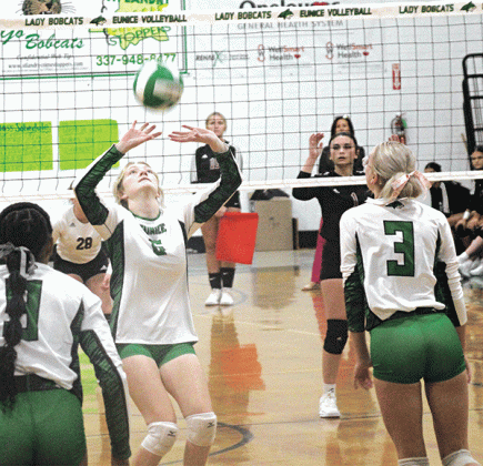 Senior Destiny Labbe sets the ball for junior Ava Grace Brown during Wednesday’s match against Jennings at the Tom Dodge Memorial Jamboree. (Photos by Rhett Manuel)