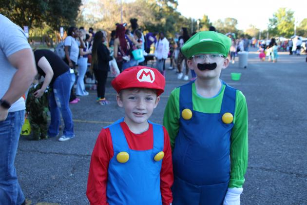 Kole Pellerin, 8, left, dressed as Mario and Ayden Loach, 11, was Luigi, at the Trunk or Treat Halloween event held at LSUE.