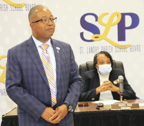 Patrick Jenkins, St. Landry Parish school superintendent, won a 12-month extension of his contract at Thursday’s School Board meeting. Board President Hazel Sias, seated, cast the tie-breaking vote for the contract. (Photos by Harlan Kirgan)