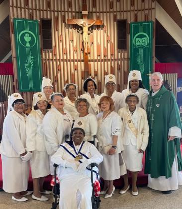 Knights of Peter Claver celebrated 79 years of membership in the national organization. Seated directly in front is Ardessie C. Francois. In front, from left, are Philomena P. Bernard, Grand Lady, Catherine Thibodeaux. Margorie S. Englan, Maudry S. Alfred, Emily S. Guillory, Alzina Richardson, and the Rev. Hampton Davis. In back, from left, are Lee J. Edwards, W. Jean Celestine, Germaine Simpson, Dorothy A. Fruge’, and Shelsy Williams.