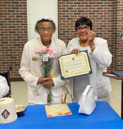 Grand Lady Philomena Bernard presents, right, a certificate to the oldest and longest member Lady Alzina Richardson who celebrated her 93rd birthday the following day. (Submitted photos)