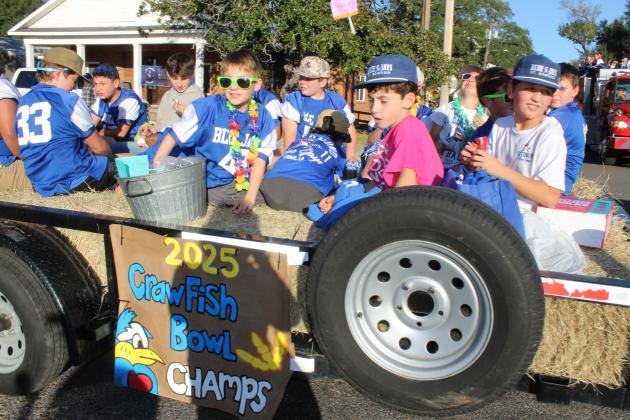 The 2025 Crawfish Bowl Champs team rode in the St. Edmund homecoming parade Friday.