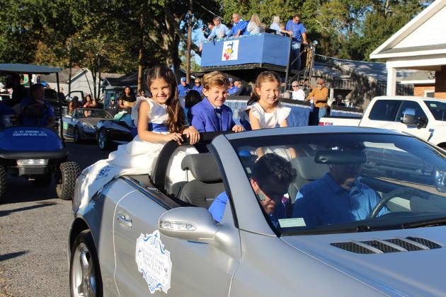 St. Ed Homecoming crown bearers. They were Hope Evans, Decker Landry and Mary Feucht.