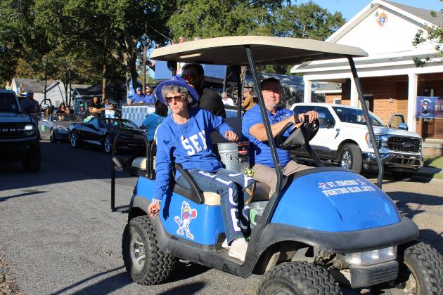 Leading the St. Ed homecoming parade were Nicole Sonnier, assistant principal; Mitch Fontenot, principal; and in the back, the Rev. John Dugas.