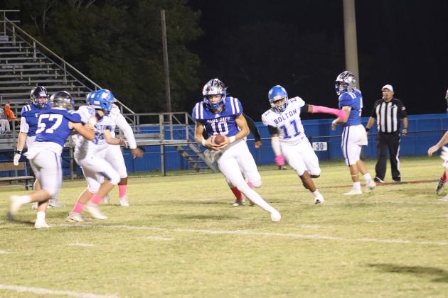 St. Edmund’s quarterback Nathan Zaunbrecher goes for a touchdown during the Blue Jays Homecoming game Friday evening. (Photo by Amy Myers)