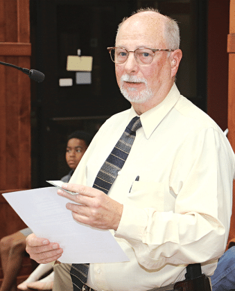 St. Landry Parish Sheriff Maj. Mark LeBlanc, Crime Stoppers coordinator, speaks to the Parish Council on Wednesday about a program to combat littering and dumping. (Photo by Harlan Kirgan)